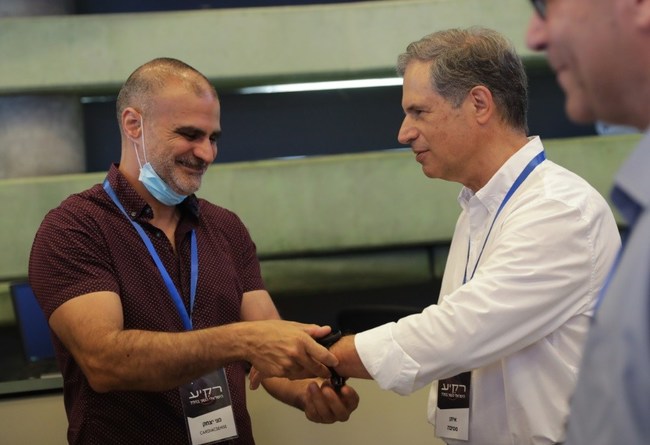 Meni Itzhak, CardiacSense VP R&D, with Eytan Stibbe, Israeli second astronaut. Credit: Elad Malka (PRNewsfoto/CardiacSense)