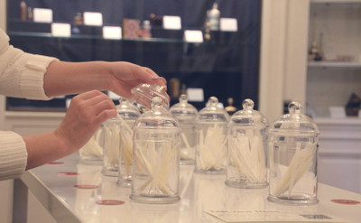 A guest samples a fragrance strip in the newly opened Perfumery Museum at the Qatar America Institute for Culture in Washington, DC.
