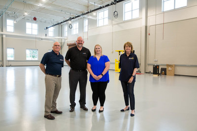 Leaders from Okuma and Rowan-Cabarrus Community College stand in the new Okuma Machine Tool Academy at the Rowan-Cabarrus Advanced Technology Center. Pictured left to right: Craig Lamb, Vice President of Corporate and Continuing Education at Rowan-Cabarrus Community College; Tim Thiessen, Vice President of Sales and Marketing at Okuma; Natalie Rogers, Training Program Manager at Okuma; and Dr. Carol Spalding, President at Rowan-Cabarrus Community College.