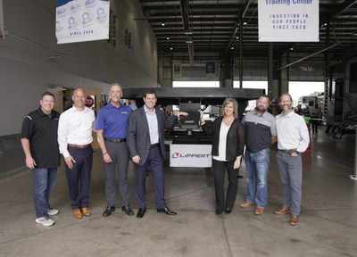 RV Retailer’s Chief Marketing Officer and Chief Technical Officer Famous Rhodes (far left) and Jon Ferrando, CEO and President, alongside LCI executive team
