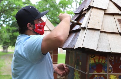 Wilde East Towne Honda in Madison, Wis. beautified Sun Prairie Dream Park for Week(s) of Service 2021. Here, volunteer Trevor Lipp helps out with some painting at the park.