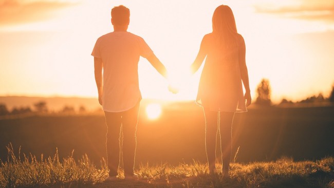Couple holding hands. Bring My Song To Life can tell your unique love story as a personalized song. No songwriting or musical skills required.
