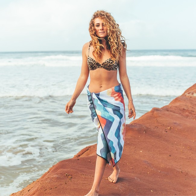 Evolve's sustainable, sand free towel with the Santorini print.