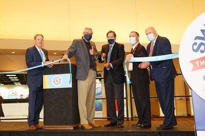 Show floor opens with ribbon cutting.