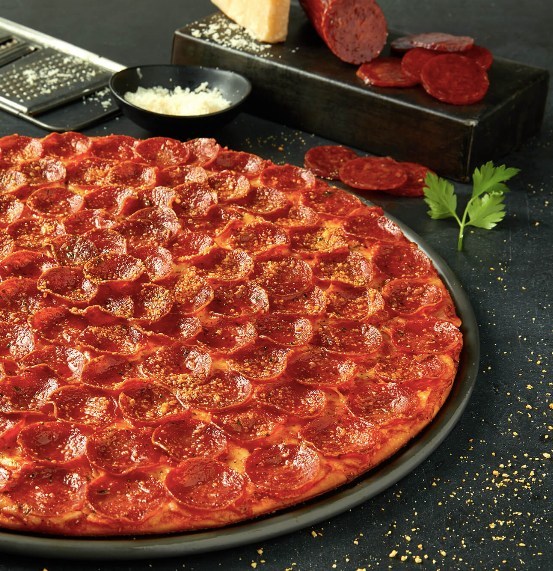 Donatos classic pepperoni pizza is loaded Edge to Edge® with 100 pieces of crispy heritage pepperoni and aged smoked Provolone