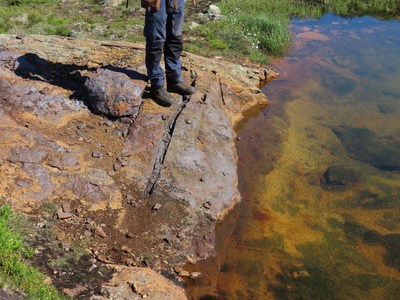 Figure 2. Oxidized massive sulfide outcrop at the Kjøli project in which channel sampling returned 2.2% Cu. (CNW Group/Capella Minerals Limited)