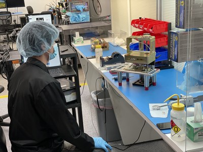 Two Maxwell Block 1 top level assemblies being integrated side by side during a production Run by technician Josh Lopez, before heading into software acceptance testing