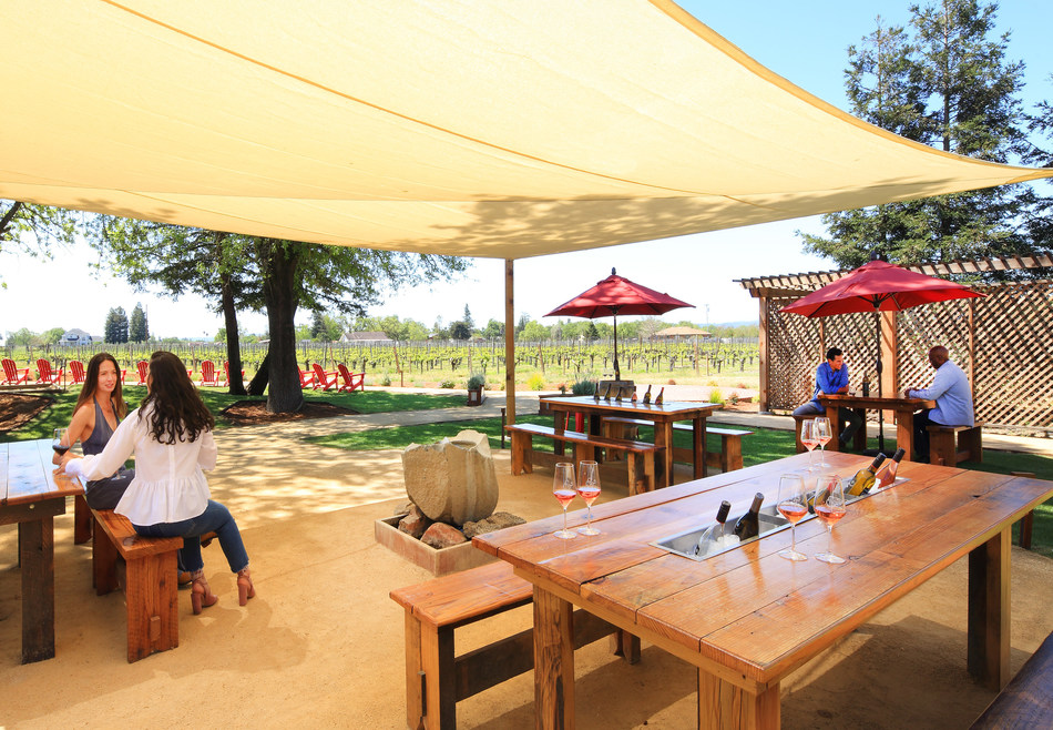 Redwood 6"x6" timbers serve as posts holding up large fabric shade sails, an important feature at Hook & Ladder Winery for guest comfort on hot days.