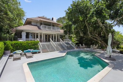 With sweeping views of Hilton Head Island’s majestic marshes and wildlife, a private dock for kayaking and boating, and an elevated, landscaped breezeway that connects a guest house to the main house, the fabulous home at 29 Baynard Park Road is a rare find today in the exclusive Sea Pines community.