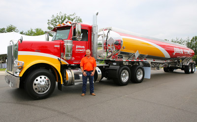 40-year driver, Daniel Abshire, stands near his custom Peterbilt truck that Pilot Company surprised him with for his years of service during a luncheon on July 7 at the company's headquarters in Knoxville, Tenn.