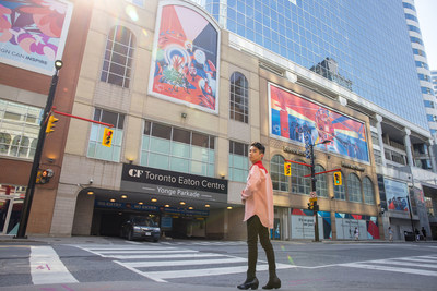 Jason Zante, OCAD University Faculty of Design student, in front of his pieces at the CF Toronto Eaton Centre Art Corridor. (CNW Group/Cadillac Fairview Corporation Limited)