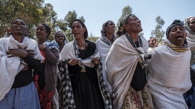 Women mourn massacre victims