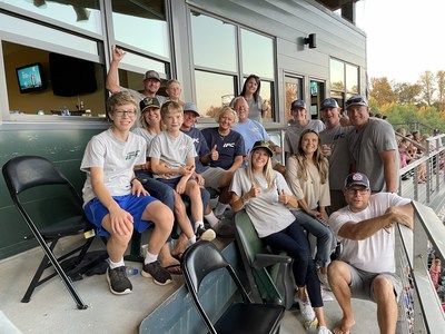 The Wright family enjoys a Eugene Emeralds game in a luxury suite, donated by COVID Clinic.