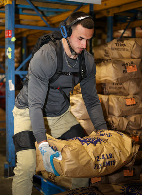 A Warehouse worker wearing Verve Motion's exosuit. Photo courtesy of ADUSA Distribution.