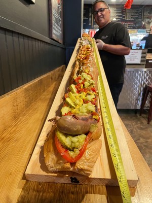 Pauli's in Boston, MA launches America's Largest Hot Dog for National Hot Dog Day.