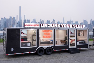 The Mattress Firm Un-Junk Your Sleep Truck in front of the New York City skyline