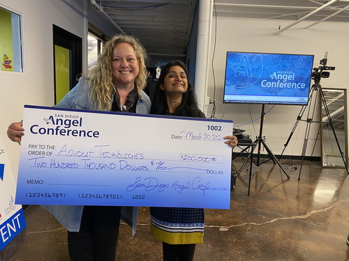 Dr. Silvia Mah, co-fund manager of San Diego Angel Conference, presents a $200,000 investment to Pradnya Desh, founder of Advocat Technologies, an artificial intelligence (AI) research and drafting solution for attorneys.