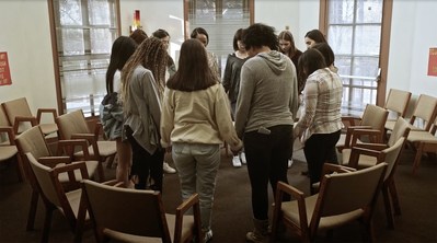 Angie: Lost Girls movie still of girls in recovery praying in church. (PRNewsfoto/Artists For Change, Inc.)