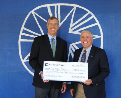 Edward "Ned" Handy III, Chairman & CEO of The Washington Trust Company and John Wolf, Executive Director of the San Miguel School in Providence, RI celebrate the <money>$200,000</money> commitment to the school's STAR Campaign.