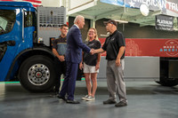 Mack Trucks today hosted President Joe Biden at its Lehigh Valley Operations (LVO) facility in Macungie, Pennsylvania, where all Mack heavy-duty models for North America and export are assembled. Left to Right, Jacob Evans, business team leader, Heather Bouchard, flex line production technician and Shawn Smith, final line production technician, with President Joe Biden by the Mack LR Electric refuse vehicle.
