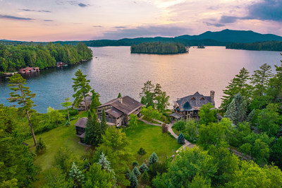 The property's western exposure provides for expansive views across the lake, in addition to views of Birch Island (seen at upper middle) and Saint Regis Mountain in the distance (upper right). It also offers spectacular evening sunsets. More at NewYorkLuxuryAuction.com.