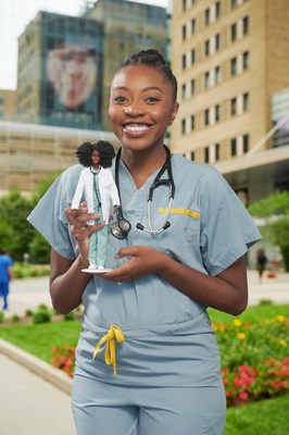 Canadian physician, Dr. Chika Stacy Oriuwa, is recognized for her contributions as a frontline medical worker during the pandemic with One-of-a-Kind Barbie doll made in her likeness. (CNW Group/Mattel Canada, Inc.)