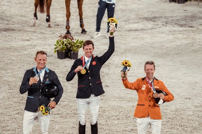 Great Britain’s Ben Maher celebrates his gold medal win in the Individual Showjumping Final at the Tokyo 2020 Olympic Games at the Baji Koen Equestrian Park. L to R: Peder Fredricson (SWE), Ben Maher (GBR), Maikel van der Vleuten (NED) (FEI/Christophe Taniere)
