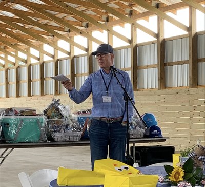 Perdue Farms President of Poultry and Premium Meats, Mark McKay, congratulates Perdue Farmer Steven Brake on the opening of his family's new Poultry Education Center, and discusses the evolution of Perdue's industry leadership in animal care.