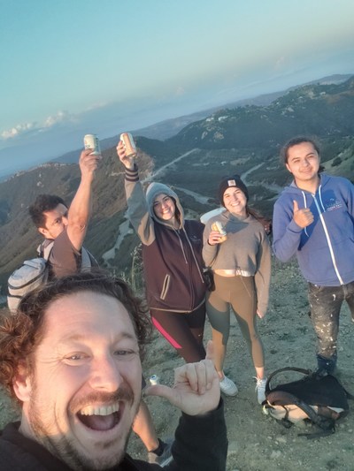 Chris Wizner, Gerardo Cardenas and Anita Hoffman with agency team on a hike enjoying life.