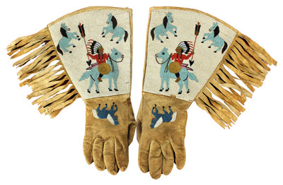 Turn-of-the-century Native American (Plateau) gauntlets, fully beaded with images of multiple figures, including Indian chiefs and horses. Cuffs adorned with long fringe. Estimate $4,500-$7,500