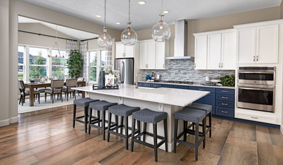 Richmond American’s Decker floor plan showcases an open layout with a stunning kitchen and dining area.