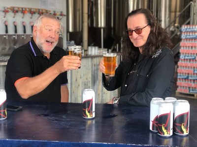 Alex Lifeson and Geddy Lee of Rush enjoying a glass of RUSH CANADIAN GOLDEN ALE, brewed in collaboration with Henderson Brewing Company, and in stores on August 30, in Ontario. (CNW Group/Henderson Brewing Company)