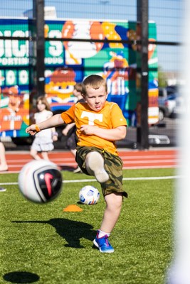 A young athlete plays soccer on the field during the grand opening of DICK’S House of Sport in Knoxville, TN.