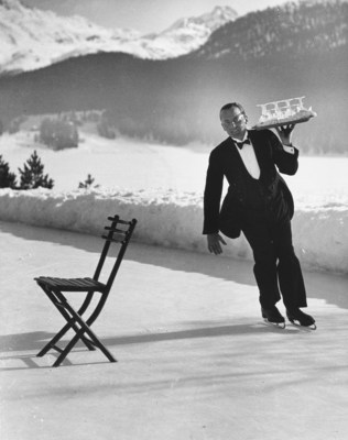Rights and Clearance is a dedicated service for Shutterstock's global customer base that obtains third party permissions across the entire portfolio of assets for promotional use. Image caption: Waiter Rene Breguet at waiter's school on skates practicing carrying tray of cocktails while on the ice at the Grand Hotel. By: Alfred Eisenstaedt/The LIFE Picture Collection/Shutterstock