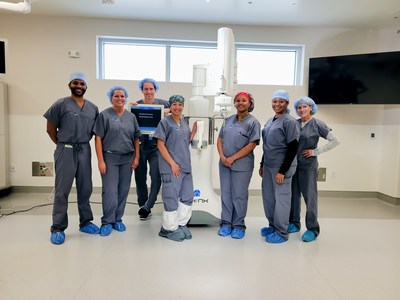 INOV8 Surgical is the first healthcare facility to utilize the second-generation TSolution One® by THINK Surgical.  Stefan Kreuzer, M.D. performed the first procedure on August 24. From L to R: Jeremy Moore, technician, THINK Surgical; Tina Hearn, lead clinical trainer, THINK Surgical; Stefan Kreuzer, M.D.; Donna Kennard, scrub technician, INOV8 Surgical; Shalmaree Brogan, scrub technician, INOV8 Surgical; Zaitasha Stepter, RN, OR circulator, INOV8 Surgical; Teri O’Laughlin, CEO, INOV8 Surgical. Photo Credit: Brandi Peace, INOV8 Research