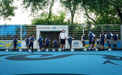 Philadelphia Union’s Youth Director of Coaching, Phil Griffiths, and children from YMCA of Greater Philadelphia’s Soccer for Success program, kick off the ceremonial first kick at the unveiling of the new Subaru Park Camden Mini-Pitch located in Camden, New Jersey, the home of Subaru of America, Inc.