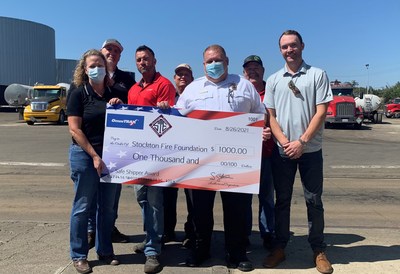 OmniTRAX honors 2020 Safe Shipper award-winner Pacific Nortwest Oil with a donation to Stockton firefighters. Ceremony participants pictured left to right. Back Row: Lance Coleman and Kevin Remyns, Pacific Northwest Oil
Front Row:  Kelli Dunn, OmniTRAX, Ricky Hegeduis, OmniTRAX, Fire Chief James Klein, Michael Walsh, OmniTRAX