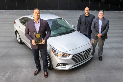 Omar Rivera (left), director, quality and service engineering, Hyundai Motor America and Barry Ratzlaff, chief customer officer, Hyundai Motor North America accept the J.D. Power IQS best small car trophy for the Hyundai Accent from Robert Mansfield (right), senior director, global automotive, J.D. Power in Fountain Valley, Calif., Aug. 31, 2021. (Photo/Hyundai)