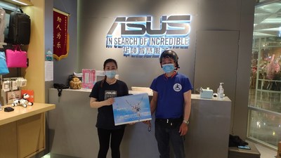 A Dada rider takes online orders for delivery at an ASUS store in Shanghai