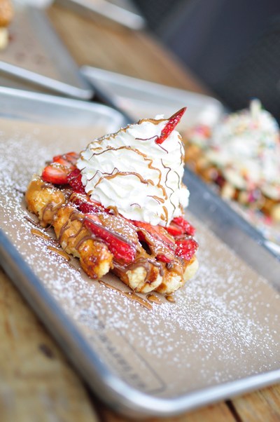"The House" Waffle with strawberries, nutella, cookie butter, and whipped cream