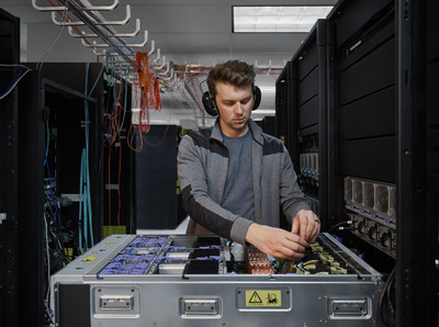 An engineer works on the IBM Power E1080. The IBM Power E1080 was designed from the ground-up for hybrid cloud environments. Photo credit: IBM