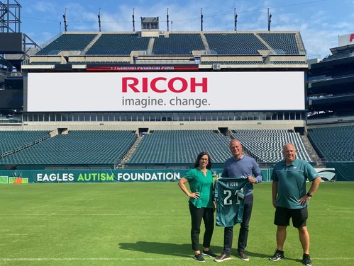 Celebrating their expanded partnership are left to right: Catherine Carlson, SVP, Revenue & Strategy, Philadelphia Eagles, Carsten Bruhn, President & CEO, Ricoh North America and Frank Gumienny, SVP, CFO, Philadelphia Eagles.
