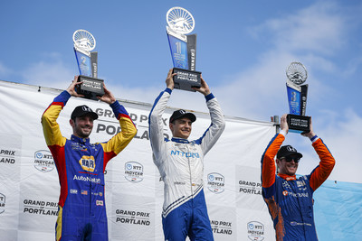Scoring his third victory of the 2021 season, Alex Palou (center) led a Honda sweep of the NTT IndyCar Series race Sunday at Portland International Raceway, with Alexander Rossi (left) finishing second and Scott Dixon (right), third.