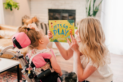 Mariah Gillaspie, the Founder and CEO of the Lightning and Love Foundation, reads a book to her daughter Emma who is affected by THAP12 epileptic encephalopathy.