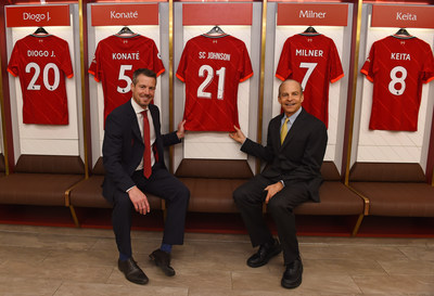 Anfield Stadium, Liverpool, 16 September 2021: [Pictured L-R] Liverpool Football Club CEO, Billy Hogan, presents SC Johnson Chairman and CEO, Fisk Johnson, with a branded LFC shirt to mark the launch of their new global sustainability partnership, Goals for Change. The partnership kicks off with a closed loop recycling model which aims to repurpose more than 500,000 plastic bottles used at Anfield each season.