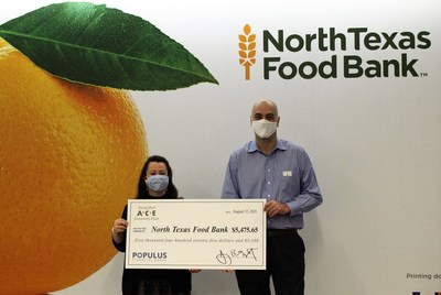 ACE Cash Express associate presents a $5,475 donation to Zahra Perez, Major Gift Officer at the North Texas Food Bank