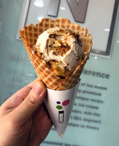 Creamistry's new limited-time Cinnamon Roll ice cream, nestled in a fresh vanilla waffle cone. Now available at all locations.