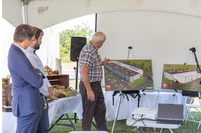 Hannes Berger and Simon Steckholzer look on as John Pedersen presents renderings of the planned expansion