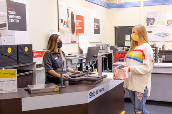 Happy Returns customer making a box-free return at a Staples retail location