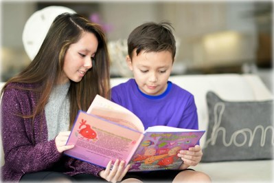 Two children reading the book "Learning About Pancreatic Cancer." By Amy Keed